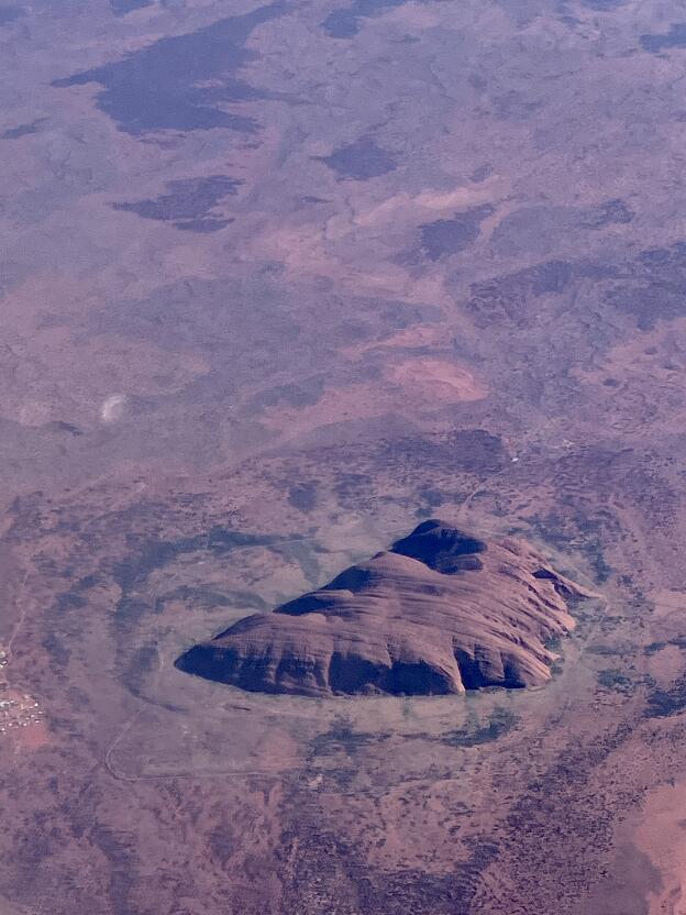 I was lucky to look out of the window when flying over Uluru (Ayer's Rock) 